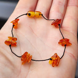 Polished Cognac Baltic Amber 3x Setting Knotted Bracelet